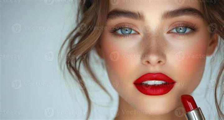 leanne bayle wearing red lipstick after filler in cleft lip treatment