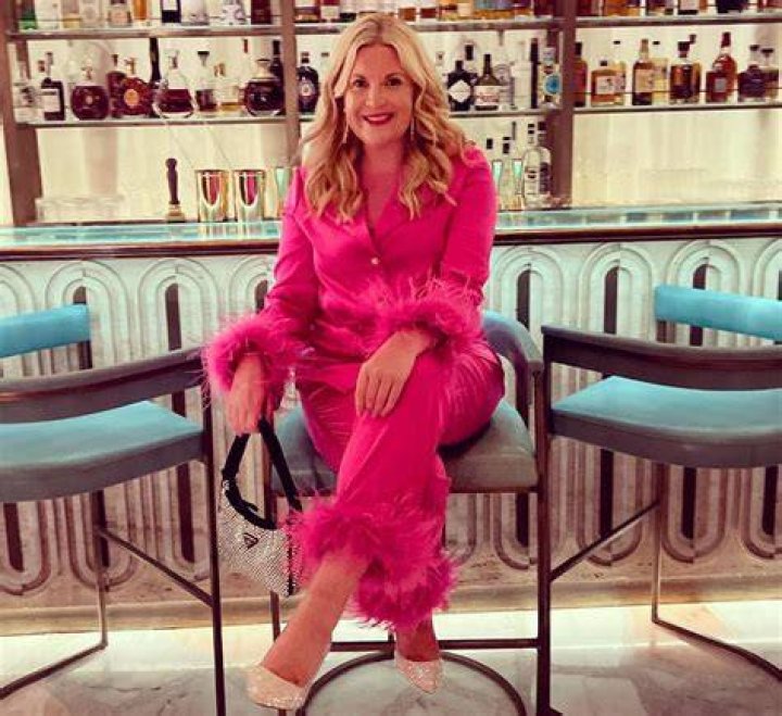 Leanne Bayley wearing a pink blazer, with cosmetic doctor Dr Bibi in silky black dress
