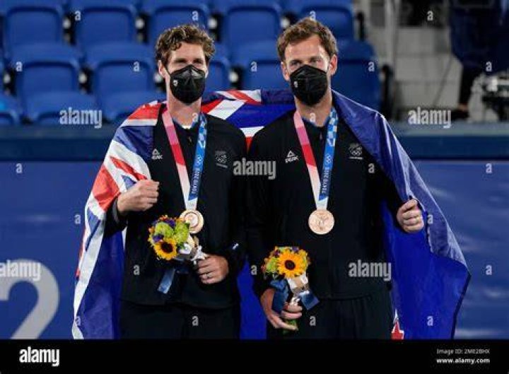 Michael Venus and Marcus Daniell celebrate a victory at the Tokyo Olympics.
